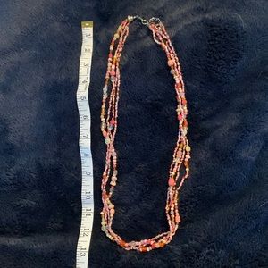 4 strand peachy pink beaded necklace